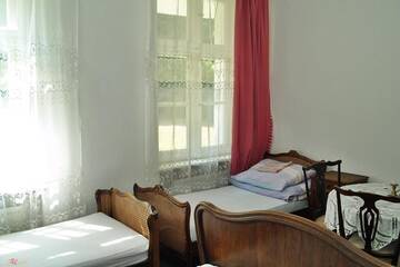 Фото номера Классический четырехместный номер Комплексы для отдыха с коттеджами/бунгало Cichy Dwór г. Manowo 7